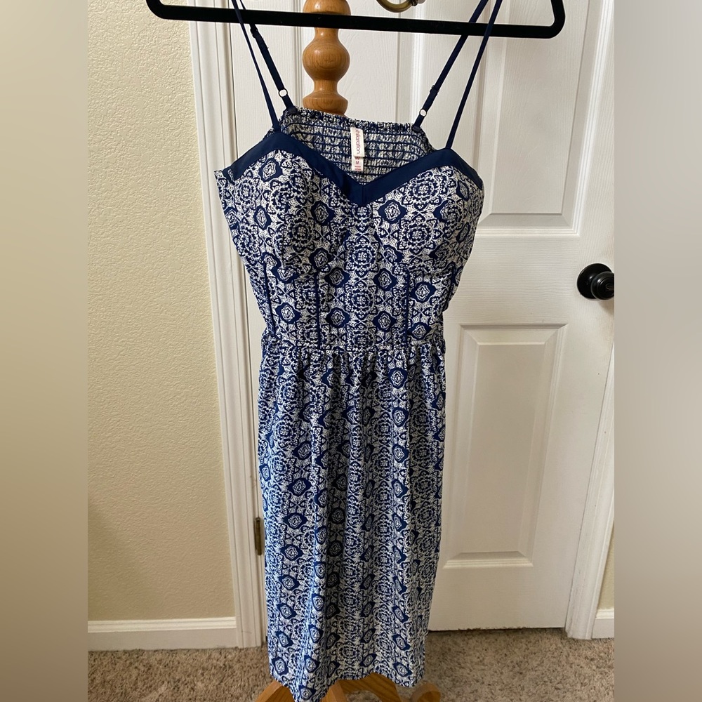 Medium blue patterned dress. Lightly padded bra on top.